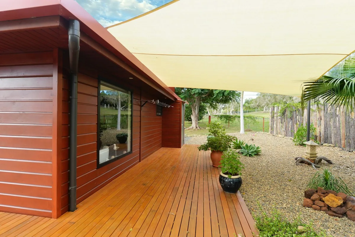 Illustrative photograph of a wood deck beside a landscaped garden